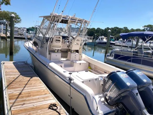 Slide: The Image of 2005 Grady-White Sailfish 282 boat docked with twin Yamaha engines. - 4