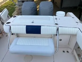 Slide: The Image of Grady-White Sailfish 282 boat interior, 2005 model, featuring cushioned seating and storage compartments. - 9