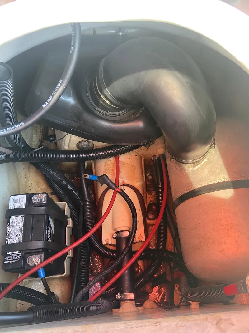 Slide: The Image of Engine compartment of a 2003 Yamaha WaveRunner FX 140 with visible battery and wiring. - 5