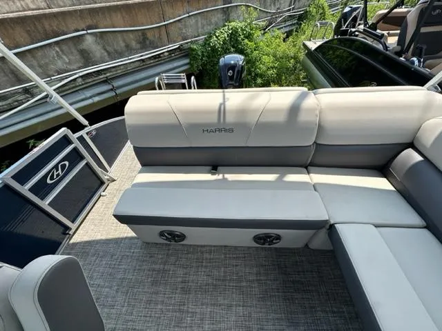 Slide: The Image of 2023 Harris 210 Cruiser boat interior with cushioned seating and modern design. - 12