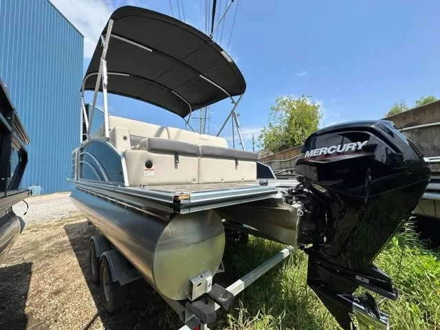 Slide: The Image of 2023 Harris 210 Cruiser pontoon boat with Mercury outboard motor. - 4