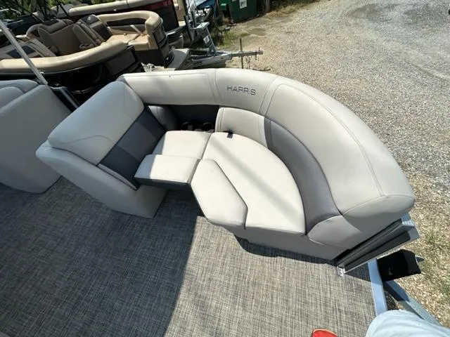 Slide: The Image of 2023 Harris 210 Cruiser boat with luxurious seating and modern design. - 7