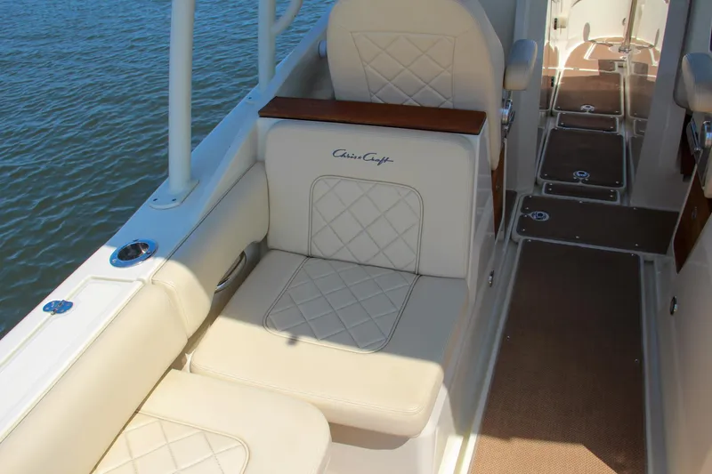 Slide: The Image of 2017 Chris-Craft Calypso 30 boat interior with cushioned seating and elegant design. - 23
