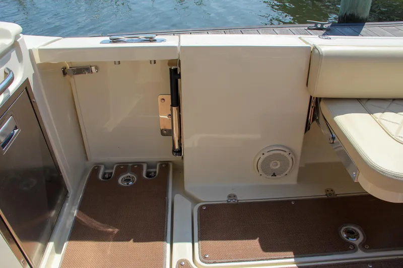 Slide: The Image of 2017 Chris-Craft Calypso 30 boat interior with open door and seating area. - 25