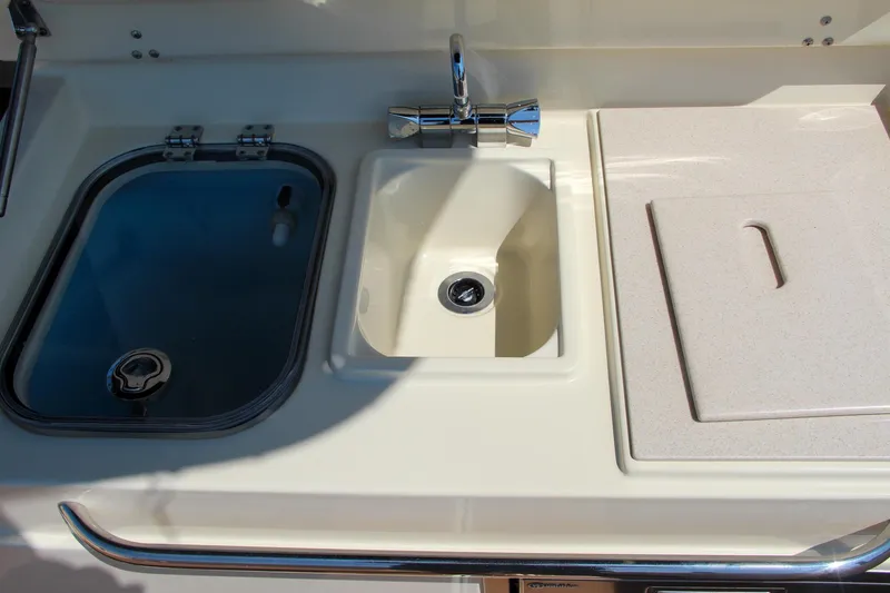 Slide: The Image of Chris-Craft Calypso 30 (2017) boat sink and storage area. - 32