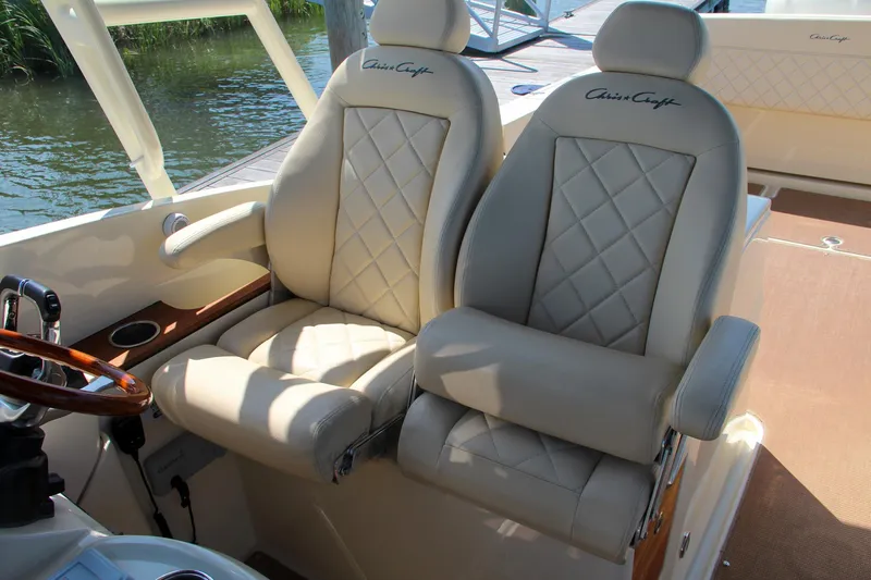 Slide: The Image of Luxurious seating on 2017 Chris-Craft Calypso 30 boat with diamond-stitched upholstery. - 34