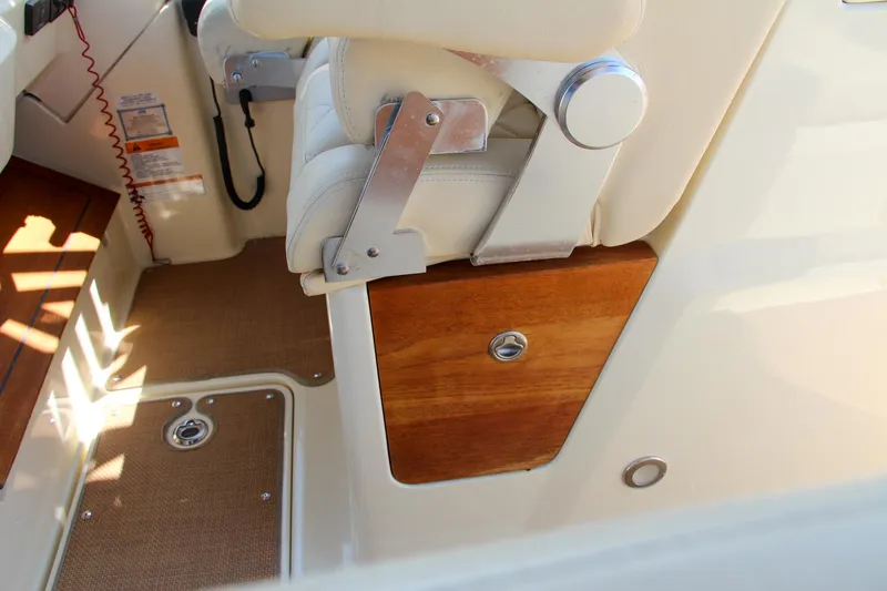 Slide: The Image of 2017 Chris-Craft Calypso 30 interior, featuring a luxurious seat and wooden paneling. - 35
