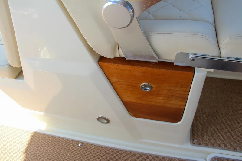 Slide: The Image of Chris-Craft Calypso 30, 2017 model, featuring elegant seating and wooden panel detail. - 36