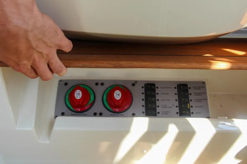 Slide: The Image of Control panel of 2017 Chris-Craft Calypso 30 boat with hand adjusting settings. - 39