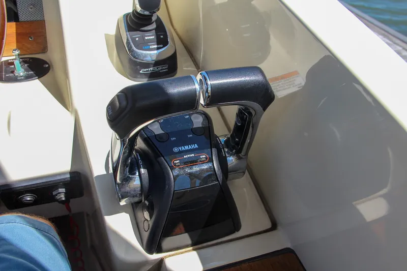 Slide: The Image of Close-up of 2017 Chris-Craft Calypso 30 throttle controls with Yamaha branding. - 43