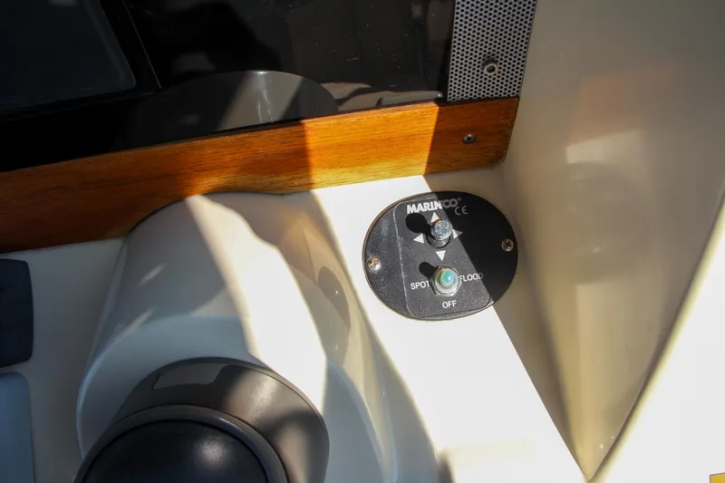 Slide: The Image of Close-up of 2017 Chris-Craft Calypso 30 boat control panel with switch. - 46