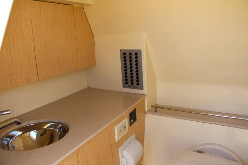 Slide: The Image of 2017 Chris-Craft Calypso 30 interior with sink and cabinetry. - 8