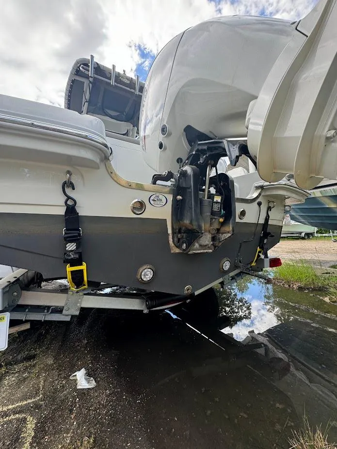 Slide: The Image of 2021 Finseeker 206 CC boat rear view with outboard motor and trailer. - 12