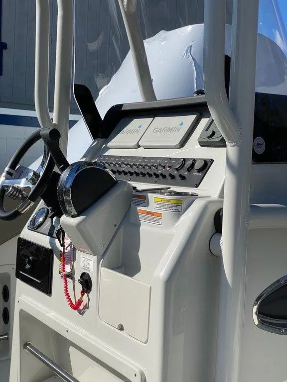 Slide: The Image of 2021 Finseeker 206 CC boat console with Garmin electronics and steering wheel. - 7