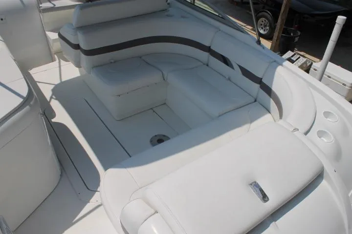 Slide: The Image of 2001 Formula 260 Sun Sport boat interior with white seating and cup holders. - 7