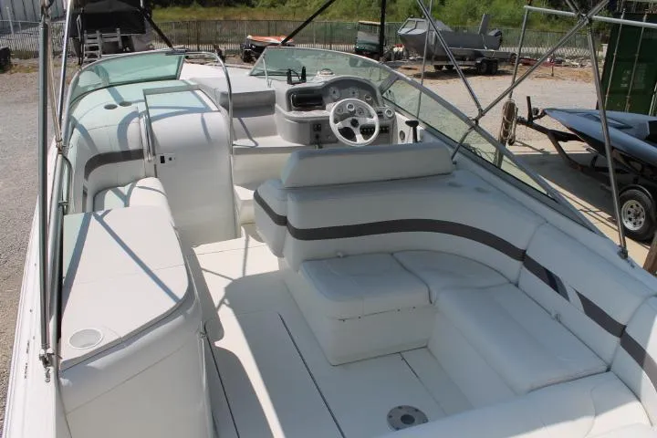 Slide: The Image of 2001 Formula 260 Sun Sport boat interior with white seating and steering wheel. - 8