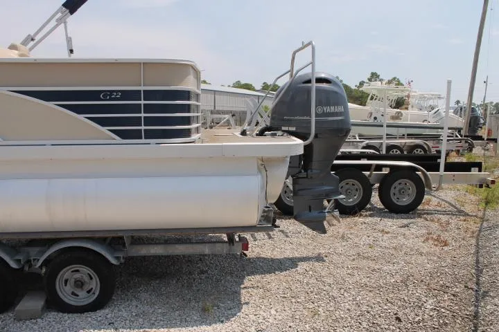 Slide: The Image of 2015 Bennington 2275 GCW pontoon boat with Yamaha outboard motor on trailer. - 3