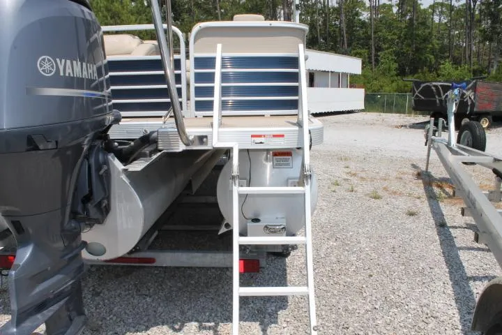 Slide: The Image of 2015 Bennington 2275 GCW pontoon boat with Yamaha motor and rear ladder. - 6
