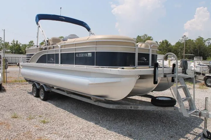 Slide: The Image of 2015 Bennington 2275 GCW pontoon boat on trailer, parked outdoors. - 7