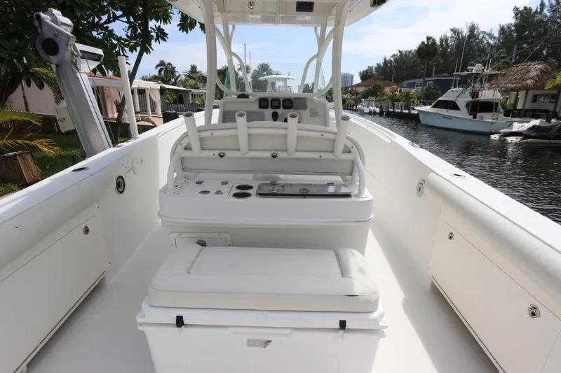 Slide: The Image of 2013 Sailfish 320 CC center console boat interior with seating and control panel. - 3