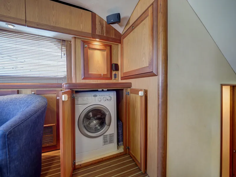 Slide: The Image of 2005 Luhrs 41 Convertible yacht interior with built-in washing machine. - 14