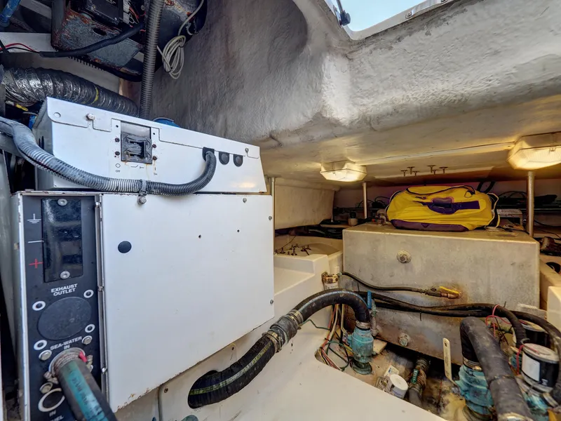 Slide: The Image of Engine room of a 2005 Luhrs 41 Convertible boat with equipment and storage. - 29
