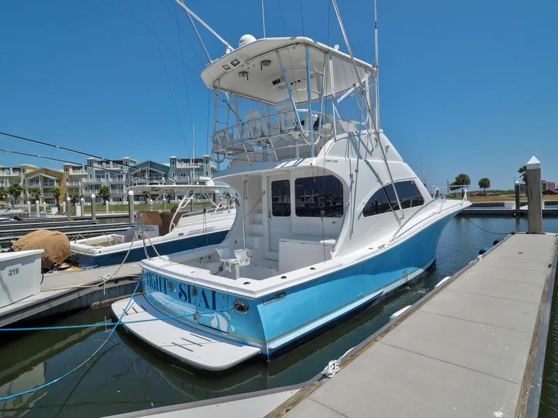 Slide: The Image of 2005 Luhrs 41 Convertible yacht docked at marina. - 3