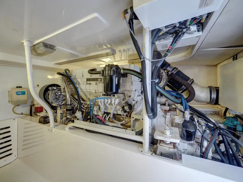 Slide: The Image of Engine room of a 2005 Luhrs 41 Convertible boat with visible machinery and wiring. - 32