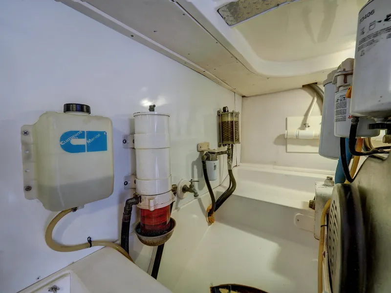 Slide: The Image of Engine room of a 2005 Luhrs 41 Convertible boat showing various components. - 35