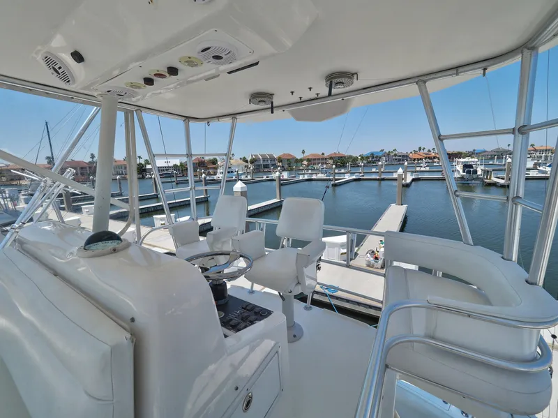 Slide: The Image of 2005 Luhrs 41 Convertible yacht helm station overlooking marina. - 39