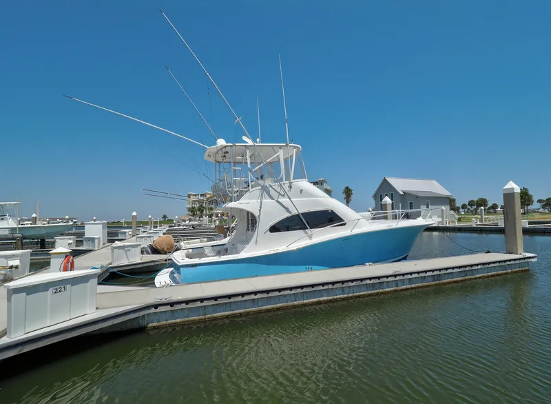 Slide: The Image of 2005 Luhrs 41 Convertible yacht docked at marina on a sunny day. - 4