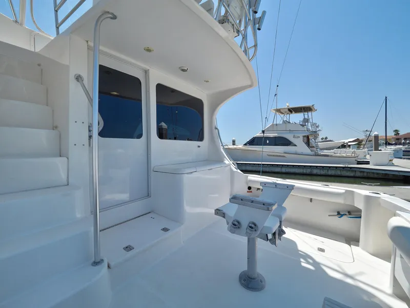Slide: The Image of 2005 Luhrs 41 Convertible yacht deck with fishing station and marina view. - 44