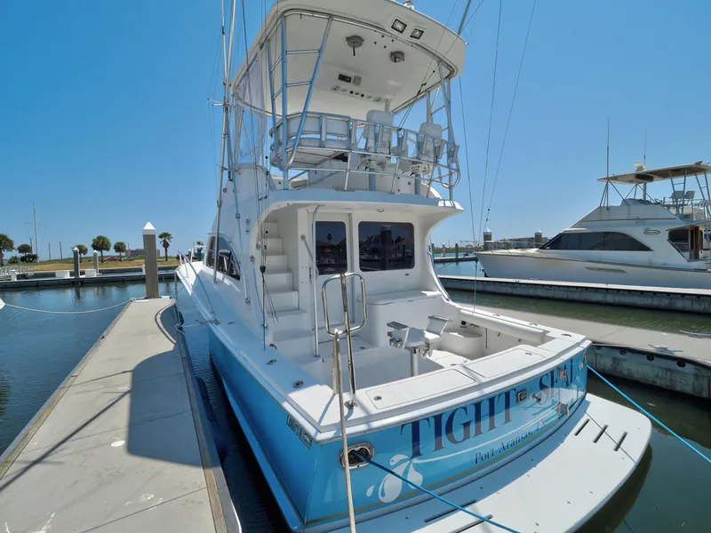Slide: The Image of 2005 Luhrs 41 Convertible yacht docked at marina on a sunny day. - 5