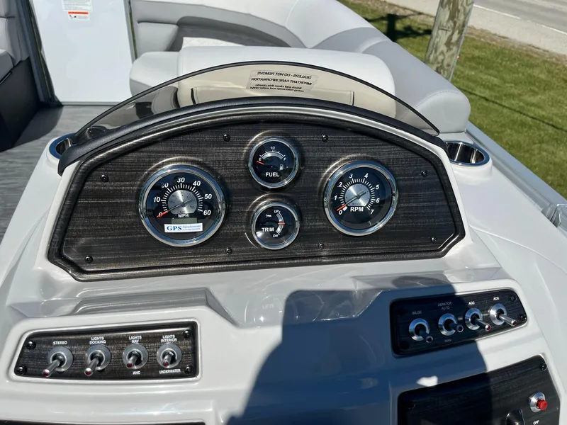 Slide: The Image of 2024 Lowe SS 170 boat dashboard with gauges and controls. - 11