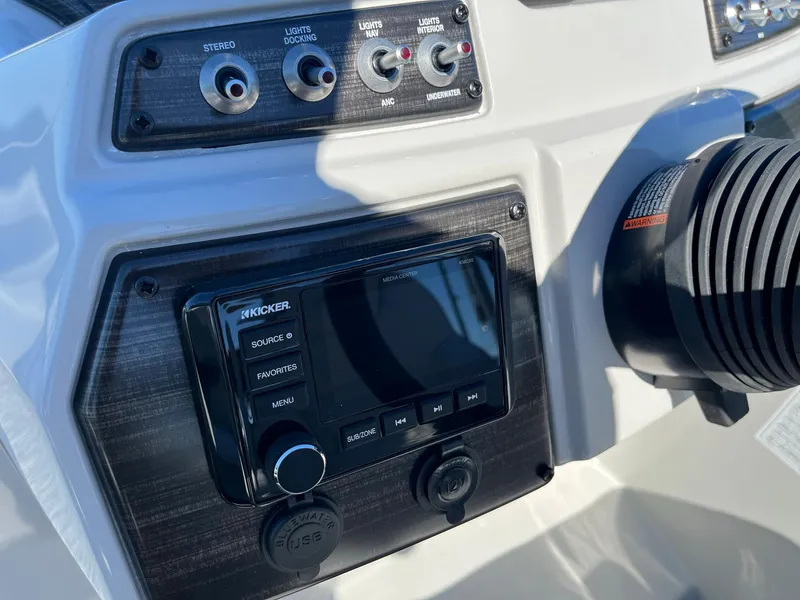 Slide: The Image of Control panel of 2024 Lowe SS 170 boat with Kicker audio system. - 12