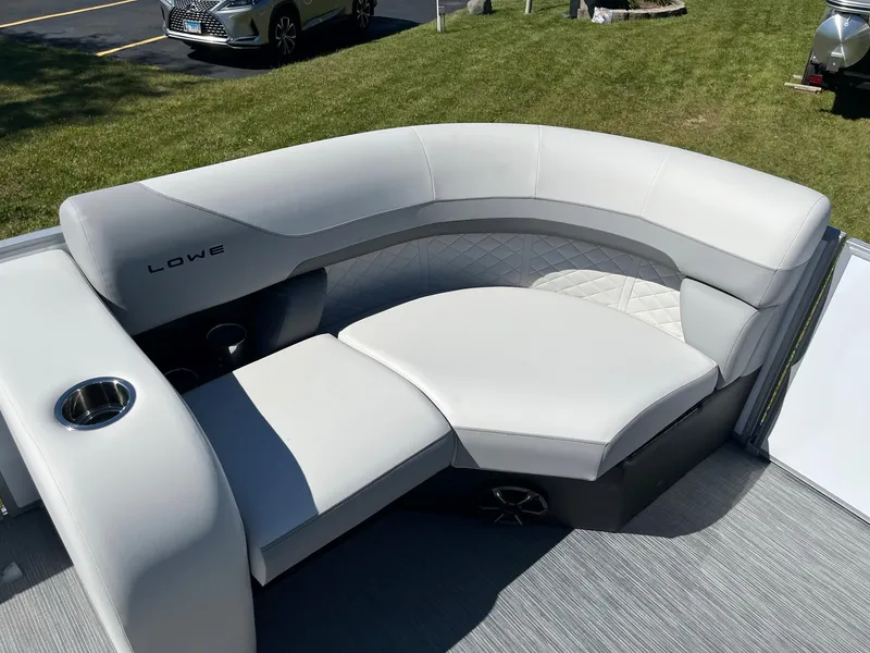 Slide: The Image of 2024 Lowe SS 170 boat with luxurious white seating and cup holders. - 14