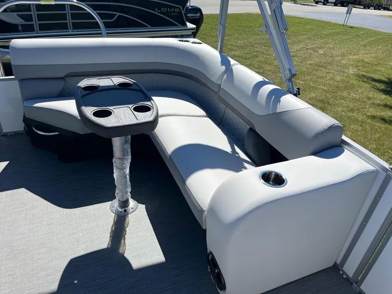 Slide: The Image of 2024 Lowe SS 170 pontoon boat with gray seating and a central table. - 15