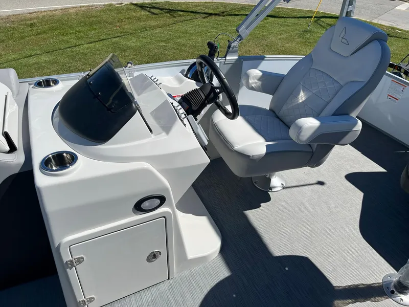Slide: The Image of 2024 Lowe SS 170 boat helm with captain's chair and control console. - 7