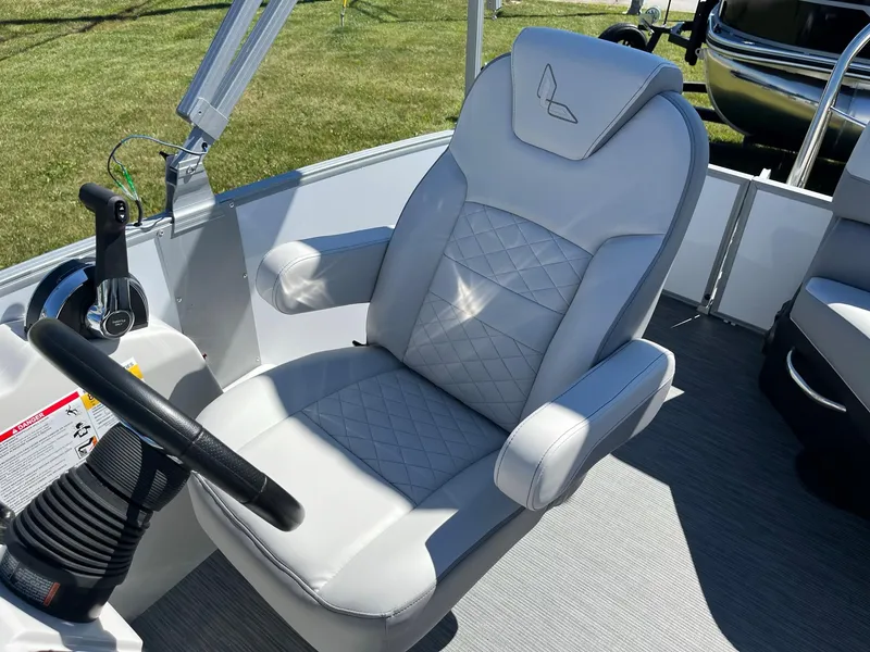 Slide: The Image of 2024 Lowe SS 170 boat captain's chair with diamond-stitched upholstery and steering console. - 8