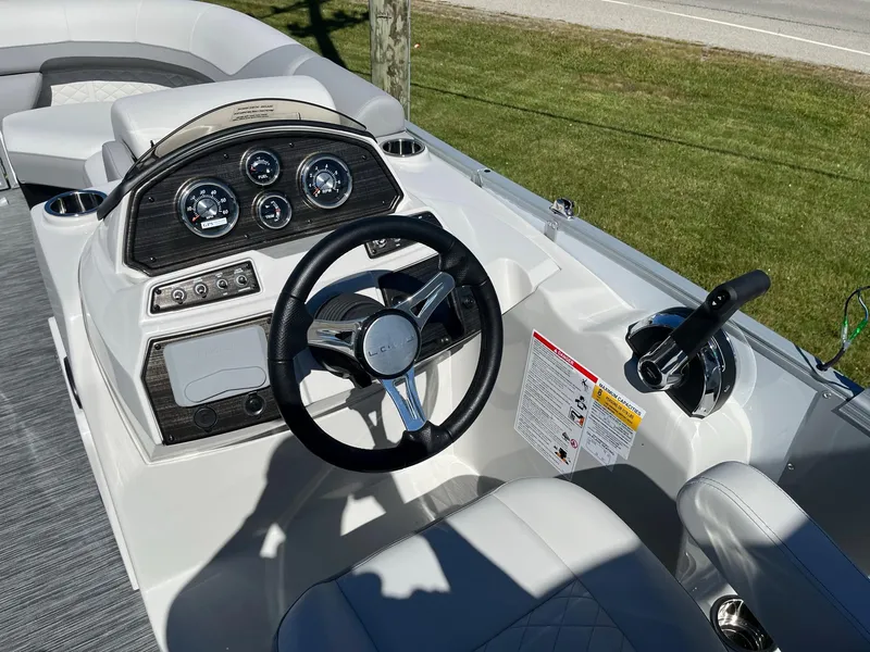 Slide: The Image of 2024 Lowe SS 170 boat dashboard with steering wheel and control panel. - 9