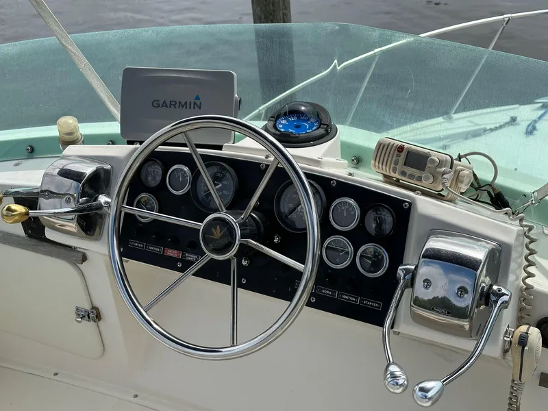 Slide: The Image of 1983 Bertram 28 boat helm with Garmin GPS and control panel. - 21