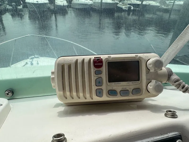 Slide: The Image of ICOM marine radio on the dashboard of a 1983 Bertram 28 boat. - 25