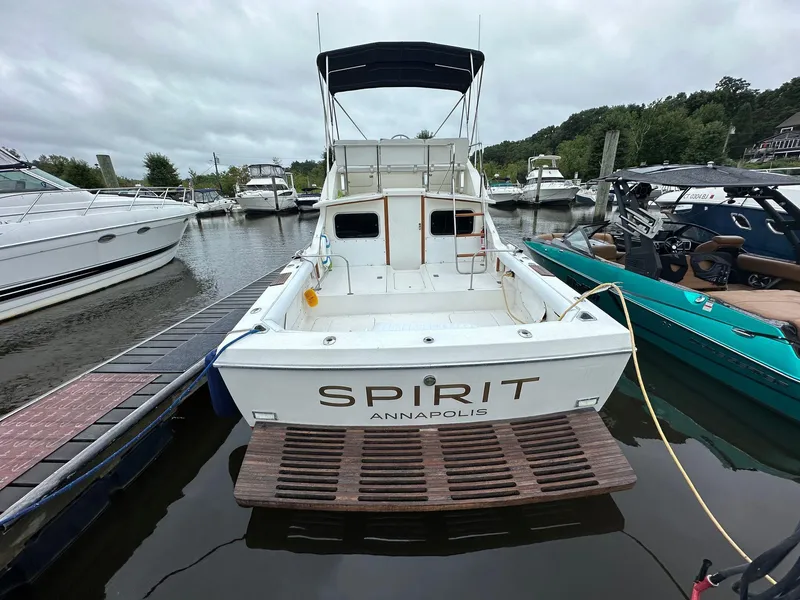 Slide: The Image of 1983 Bertram 28 boat named Spirit docked in Annapolis marina. - 7