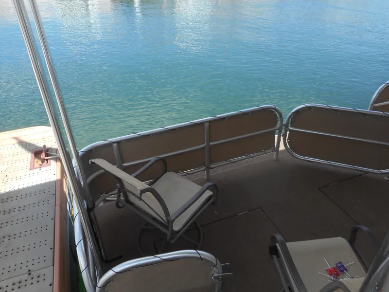 Slide: The Image of Deck view of 2004 Sharpe Mysterious Waves houseboat with chairs overlooking water. - 11