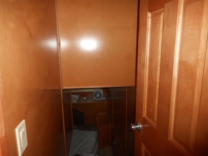 Slide: The Image of Small wooden room interior with a bed, featuring Sharpe Mysterious Waves design, 2004. - 24