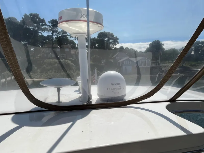 Slide: The Image of 1997 Sea Ray 420 Aft Cabin boat with radar and satellite equipment. - 20