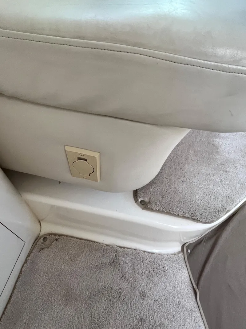 Slide: The Image of Interior of a 1997 Sea Ray 420 Aft Cabin with beige upholstery and carpet. - 44