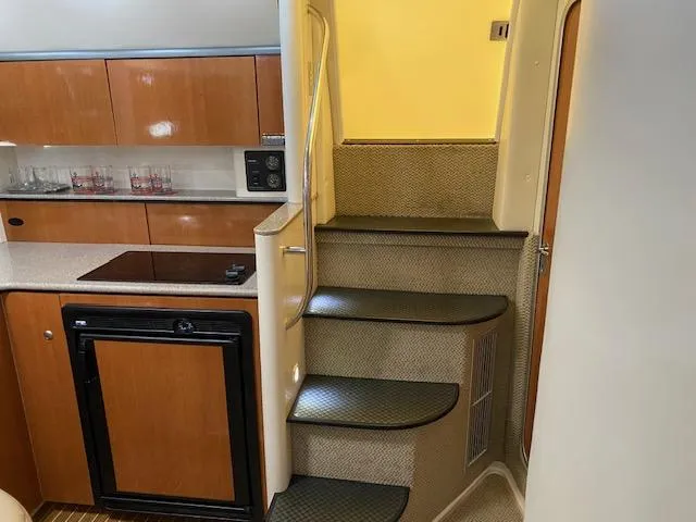 Slide: The Image of Interior of 2005 Maxum 3500 SY yacht with kitchen and stairs. - 10