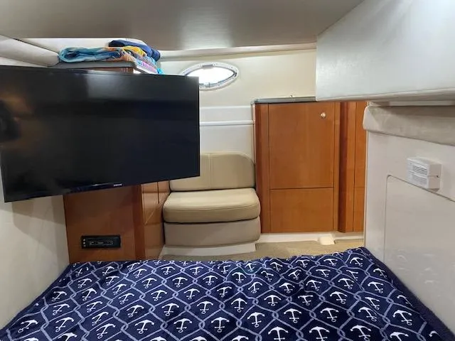Slide: The Image of Interior cabin of a 2005 Maxum 3500 SY boat with TV and seating area. - 13