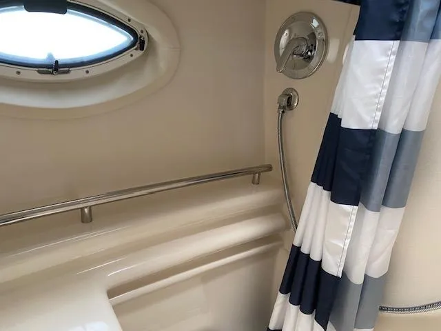 Slide: The Image of 2005 Maxum 3500 SY boat bathroom with shower and striped curtain. - 18
